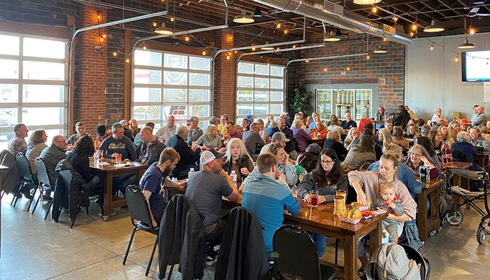Large group of people at brewery for trivia