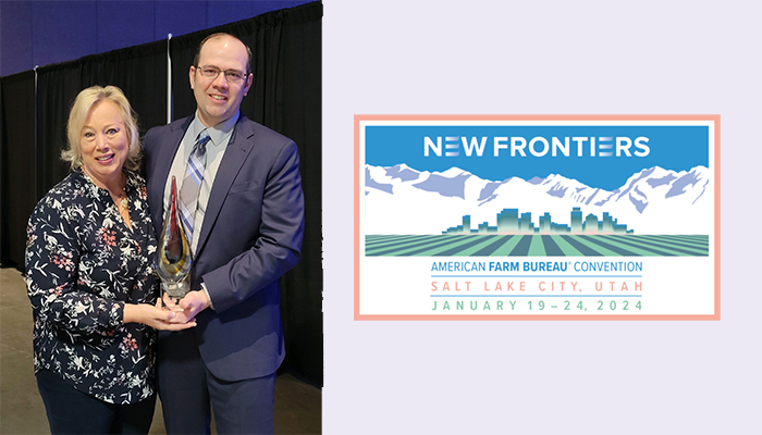 two people holding an award; conference logo