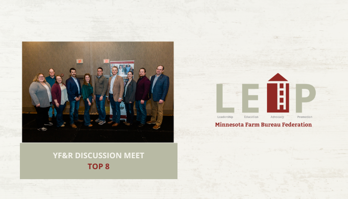 group of people standing on stage