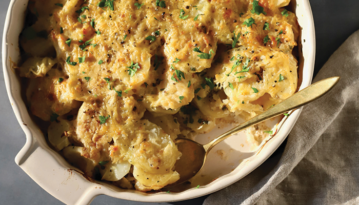 overhead photo of scalloped potatoes in serving dish