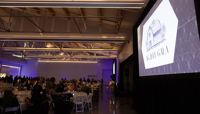group of entire venue space and tables with attendees