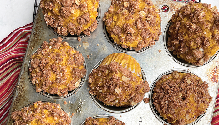 overhead photo of pumpkin snickerdoodle muffins in muffin tin
