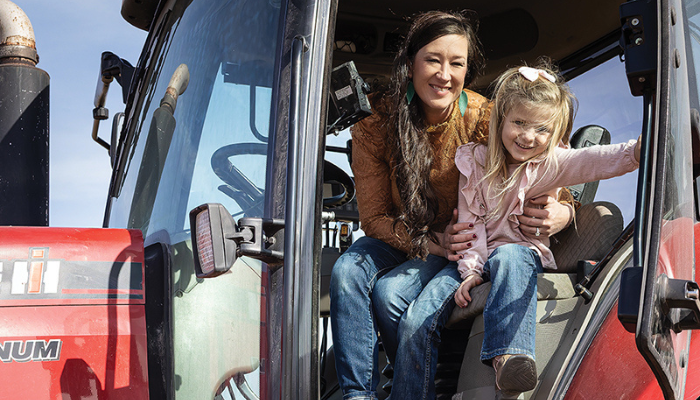 Mother and daughter in a tractor