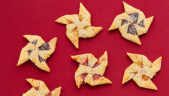 overhead photo of cookies on red tablecloth