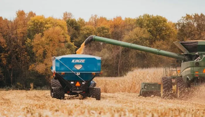Combine and wagon during harvest