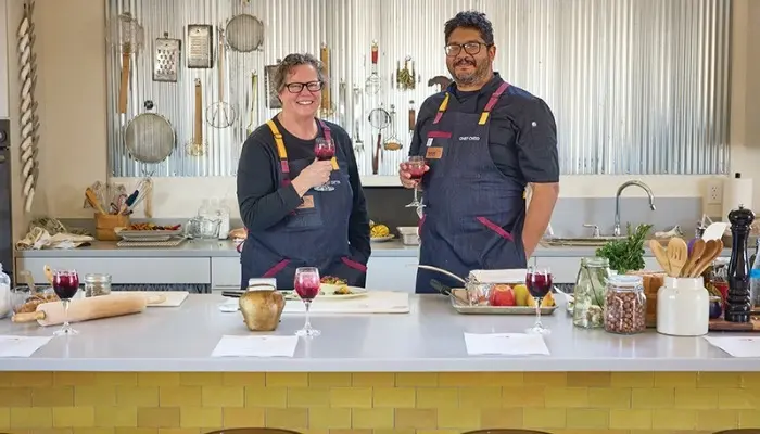 Chef Beth and Chef Cheo Smith smile for a photo