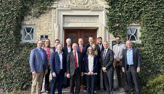 group of people standing in front of a building