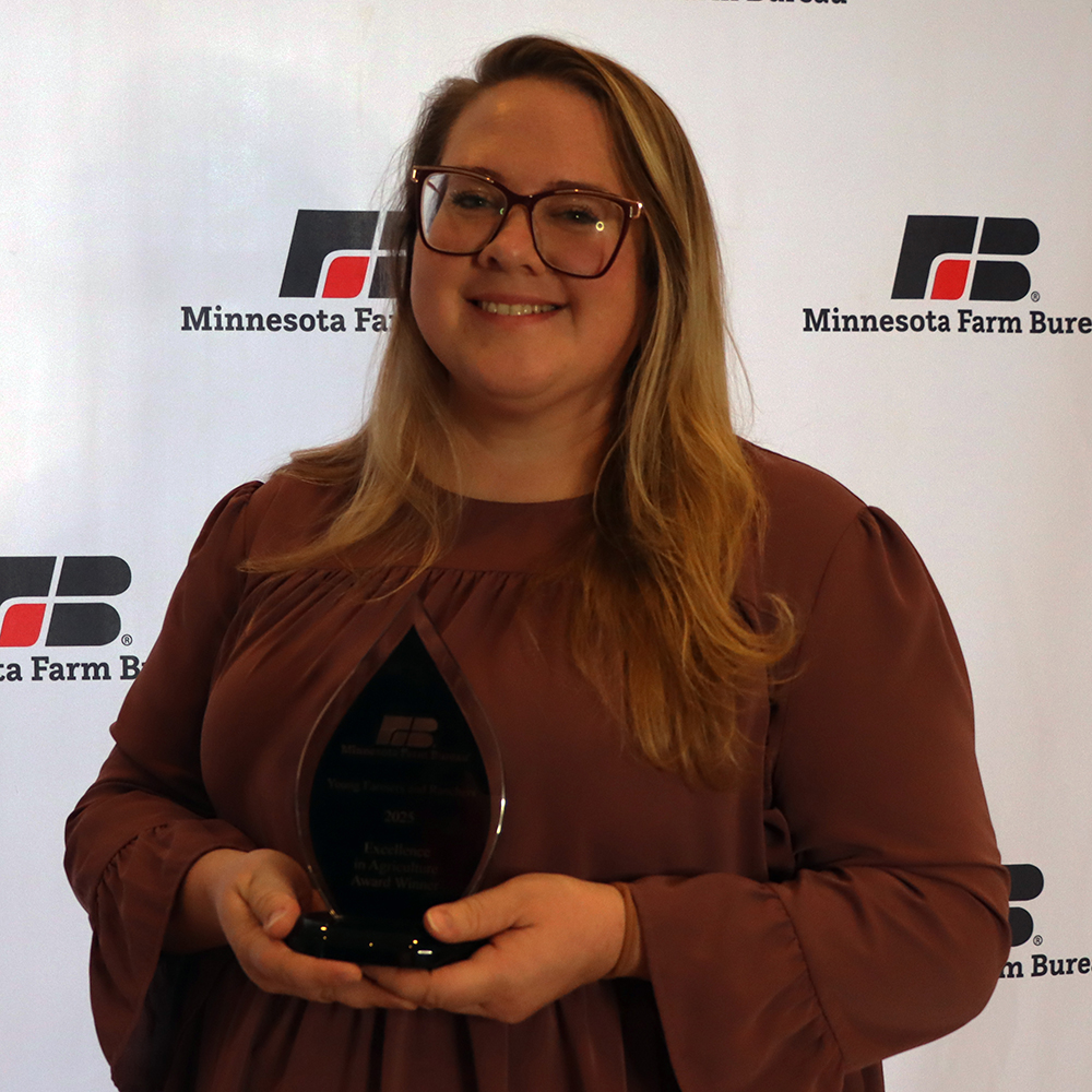Excellence in Ag award winner Hannah Molitor holding award